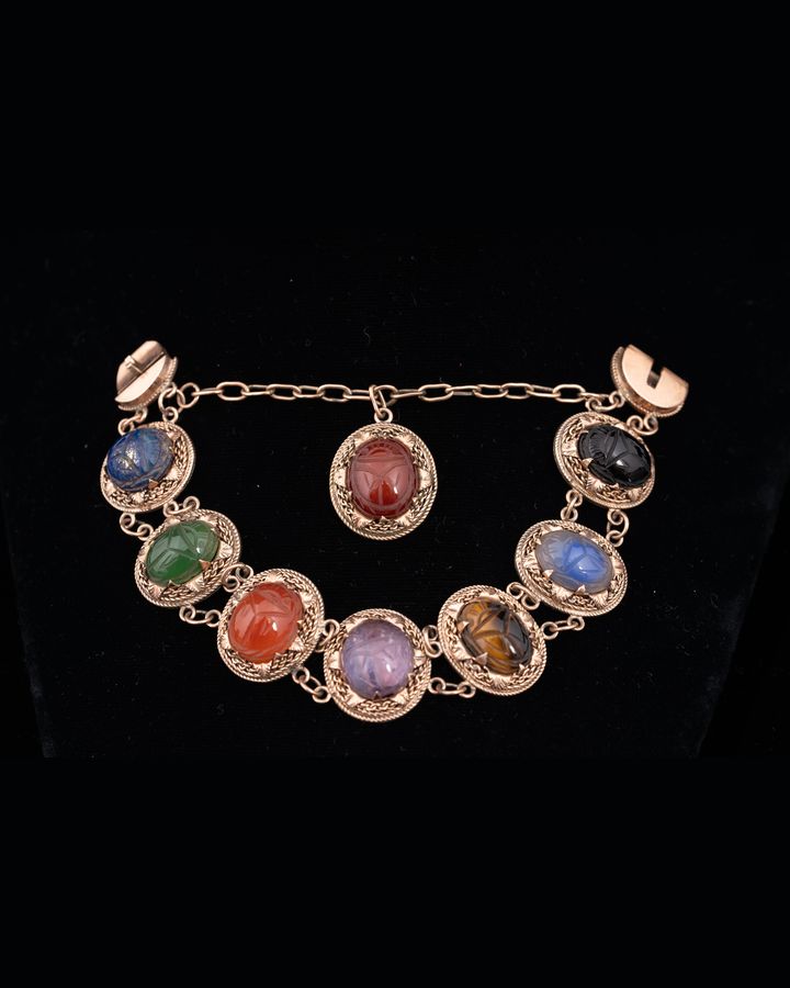 Lot 700: 10K Gold Carved Gemstone Scarab Bracelet